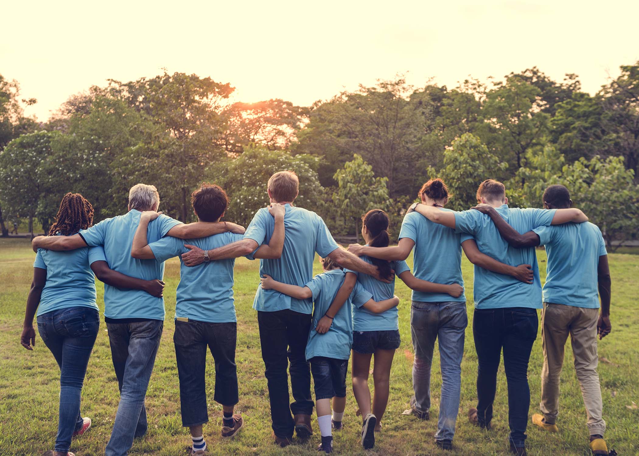 Image of a group hugging each other as a sign of community and collaboration.